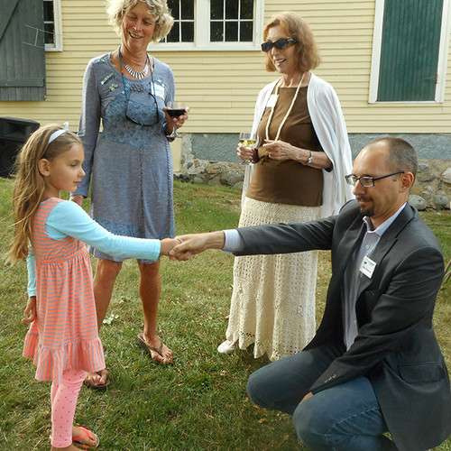 Nik greets Nancy's granddaughter and she and Tonyia look on. Photo by Lucie LaChance.