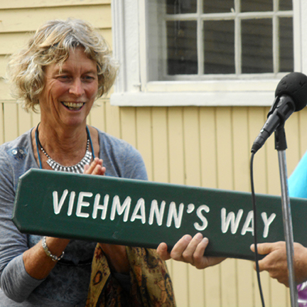 Nancy receives her Viehmann's Way trail sign. Photo by Lucie LaChance.